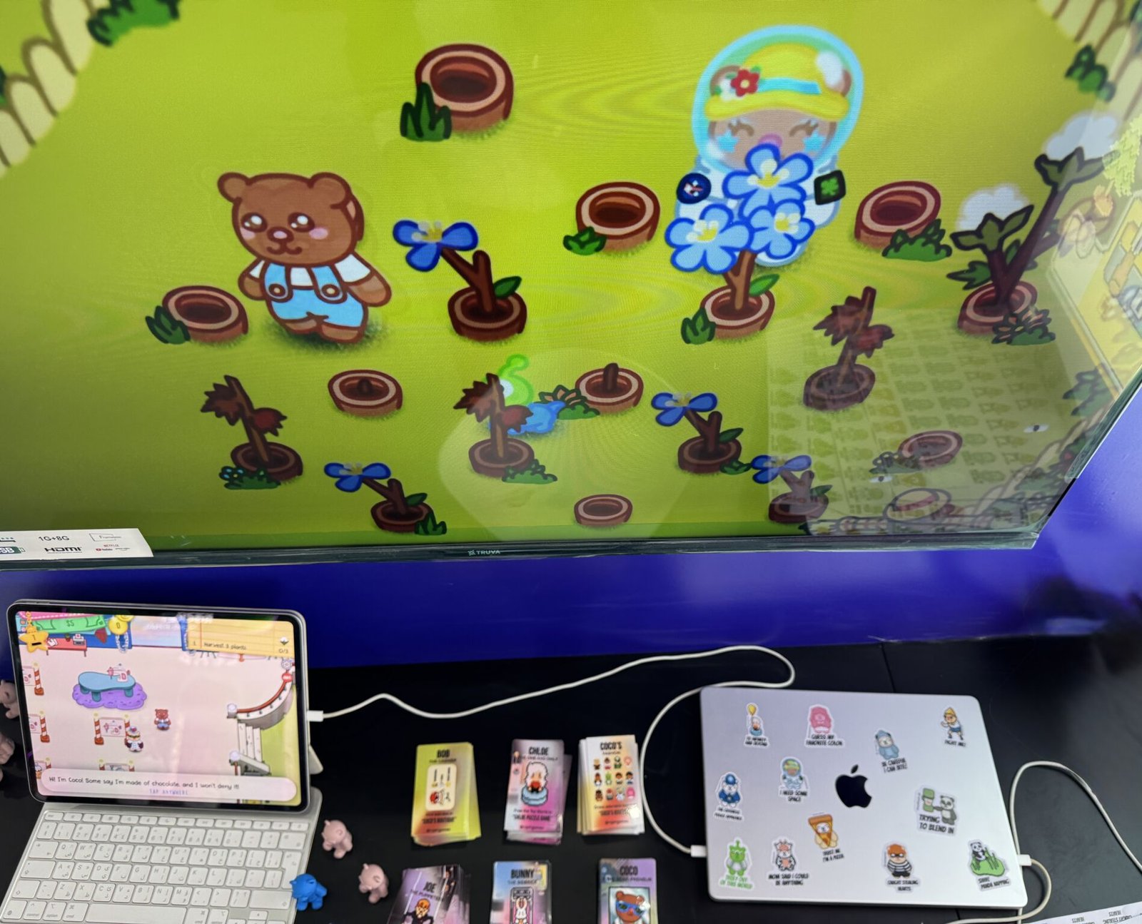 Our booth at LEAP: Coco's Fashion on the big screen, cards and stickers