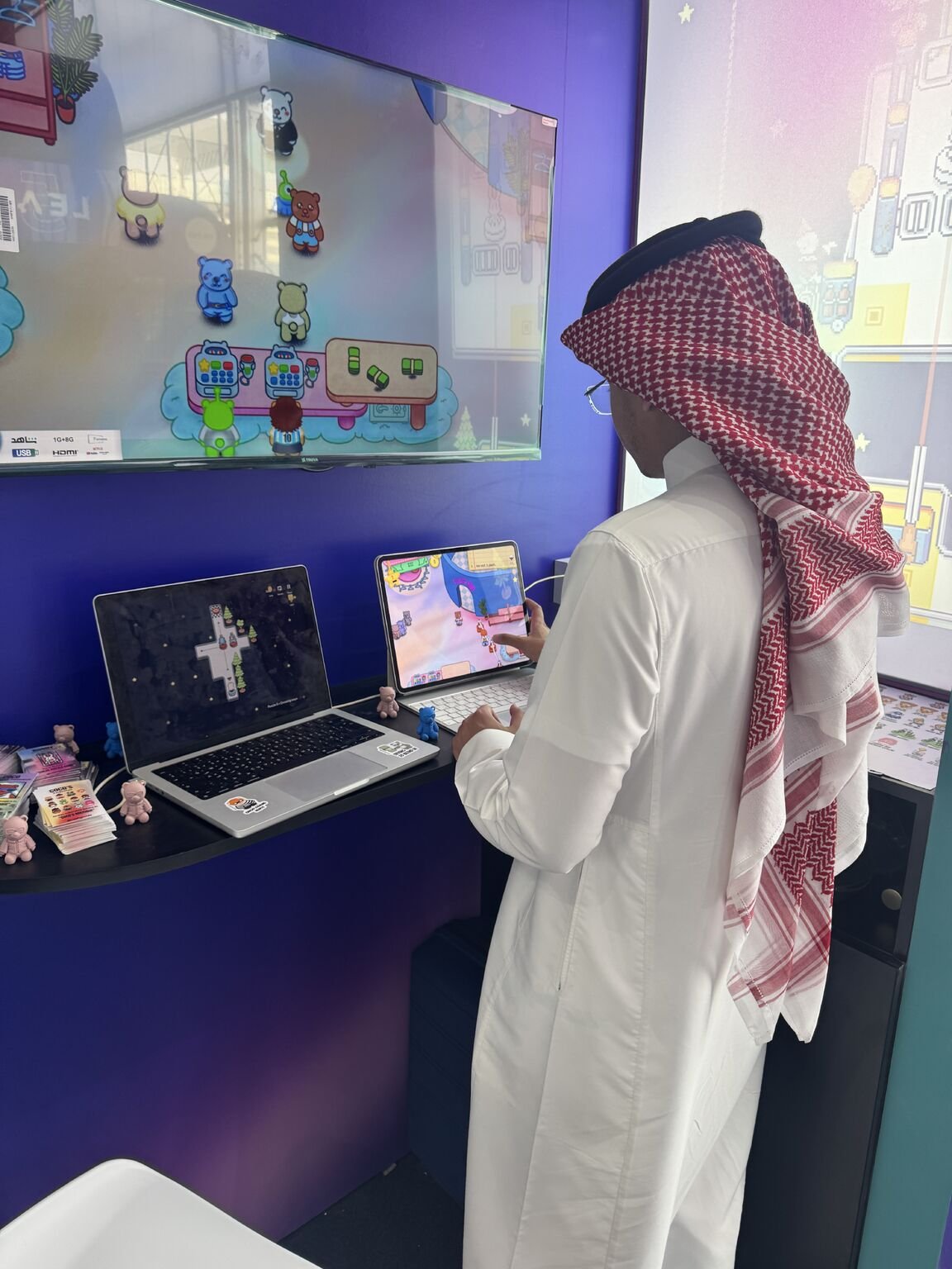 A player trying our games at the LEAP booth
